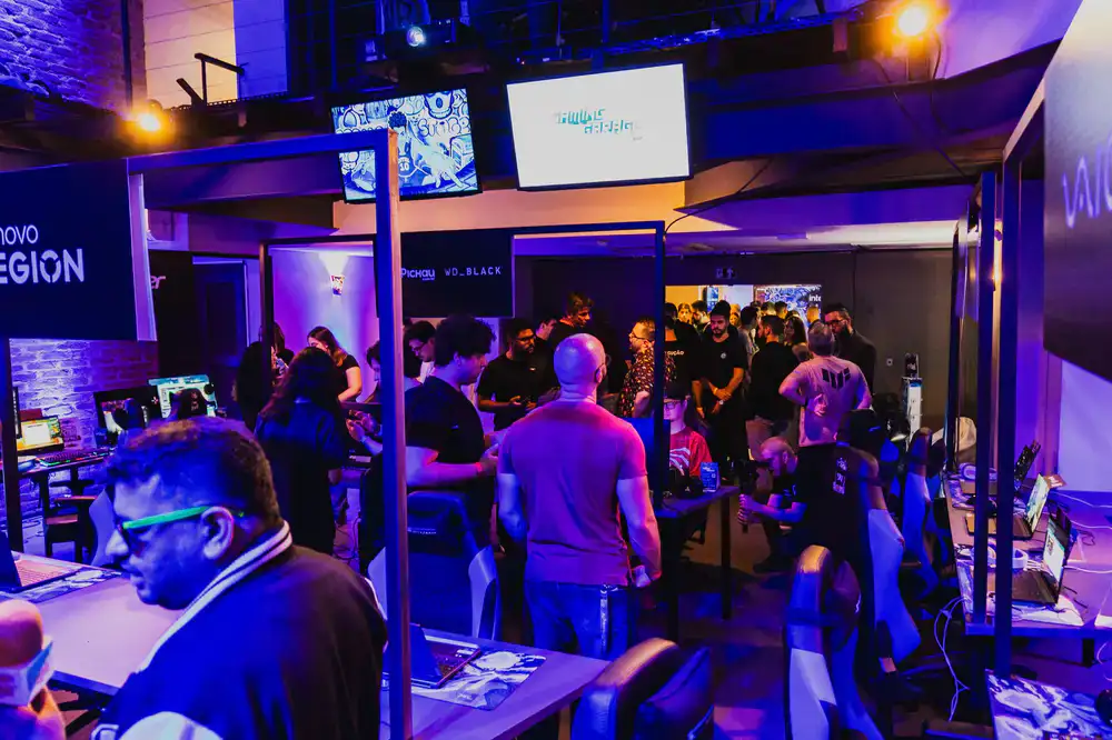 Players gathered around screens during a local esports tournament